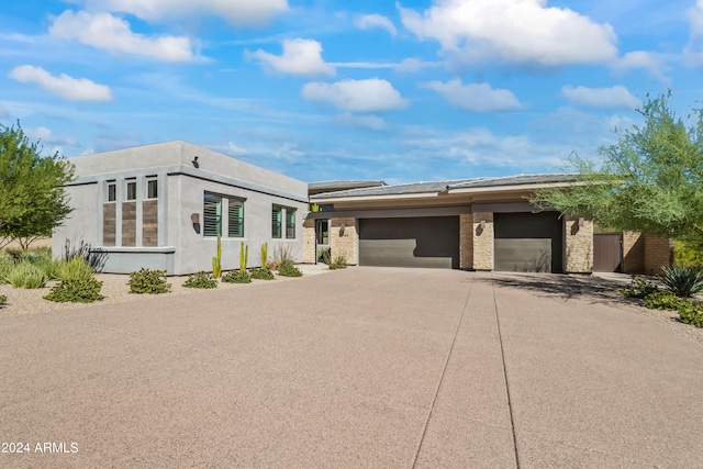 view of front of home with a garage