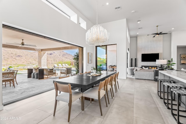 dining space with a notable chandelier and a high ceiling