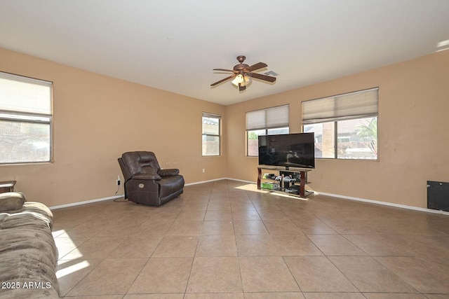 16112 W Durango St, Goodyear, AZ 85338 - unfurnished living room featuring a ceiling fan, baseboards, and tile patterned flooring