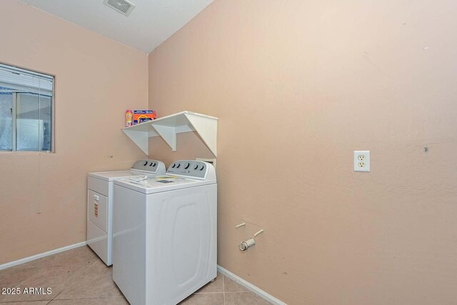 16112 W Durango St, Goodyear, AZ 85338 - washroom with laundry area, visible vents, baseboards, light tile patterned flooring, and washer and dryer