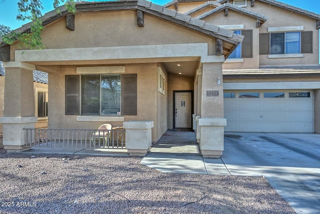 16112 W Durango St, Goodyear, AZ 85338 - view of front facade featuring a garage, driveway, and stucco siding