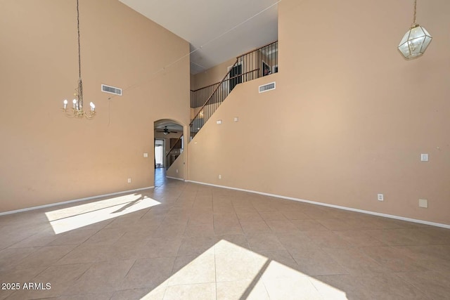 16112 W Durango St, Goodyear, AZ 85338 - unfurnished living room featuring visible vents, a high ceiling, tile patterned flooring, and stairway