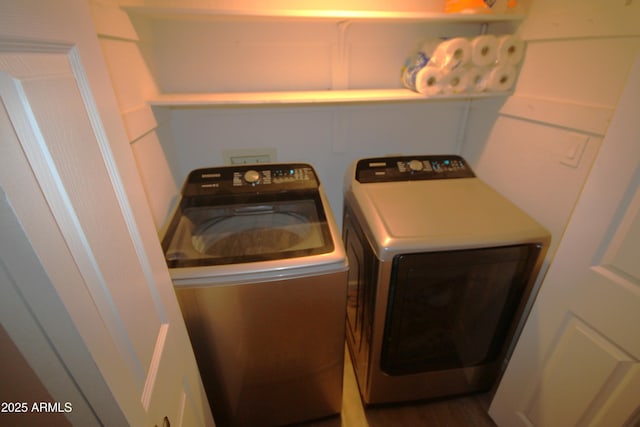 laundry area with separate washer and dryer and laundry area