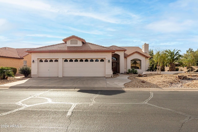 view of front of property with a garage