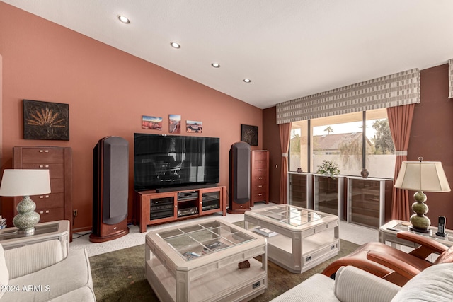 carpeted living room with lofted ceiling