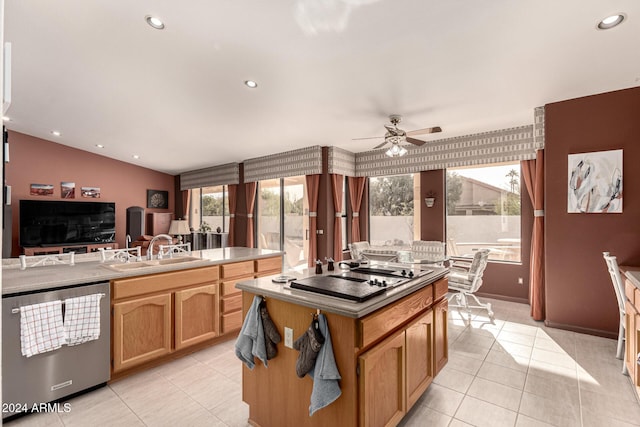 kitchen featuring sink, stainless steel dishwasher, ceiling fan, black electric cooktop, and light tile patterned flooring