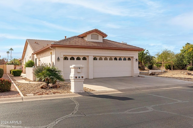 view of front of home with a garage