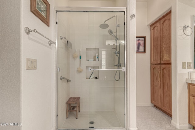 bathroom with vanity and walk in shower