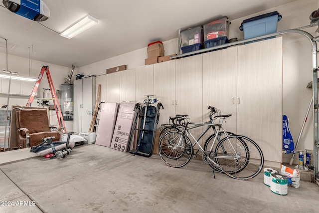 garage with a garage door opener and water heater