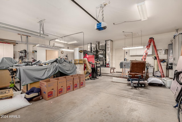 garage featuring gas water heater and a garage door opener