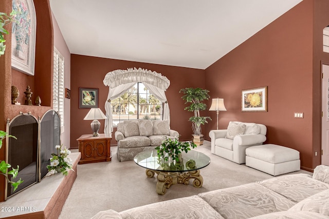 carpeted living room featuring lofted ceiling