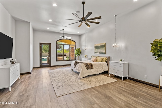 bedroom featuring access to exterior, baseboards, wood finished floors, and recessed lighting