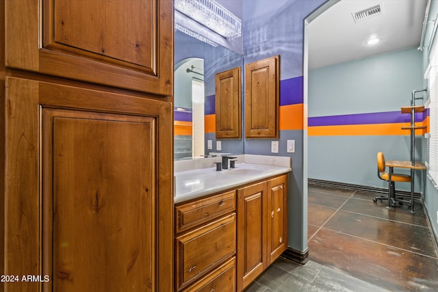 bathroom featuring tile patterned flooring, vanity, and visible vents