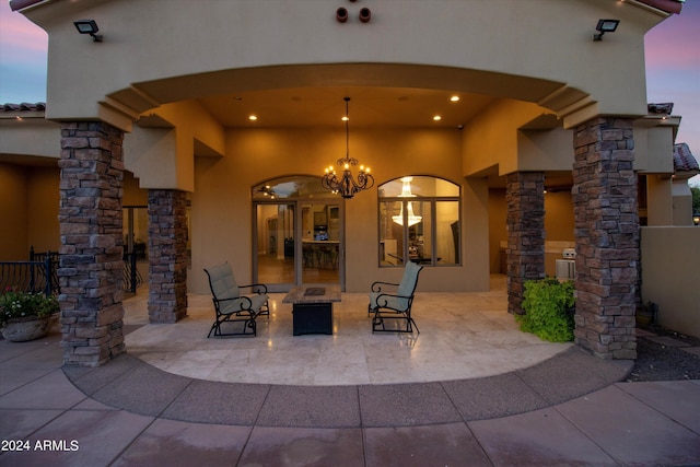 view of patio terrace at dusk