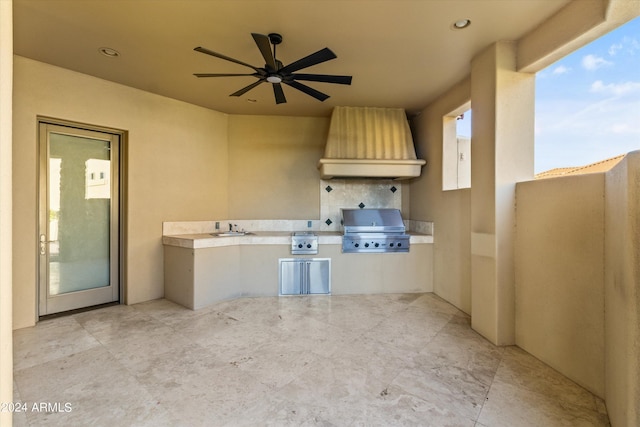 view of patio featuring a sink, area for grilling, a grill, and a ceiling fan