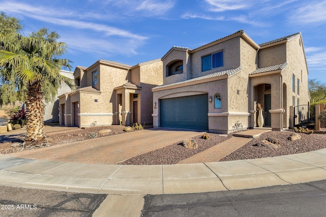 mediterranean / spanish-style home with a garage