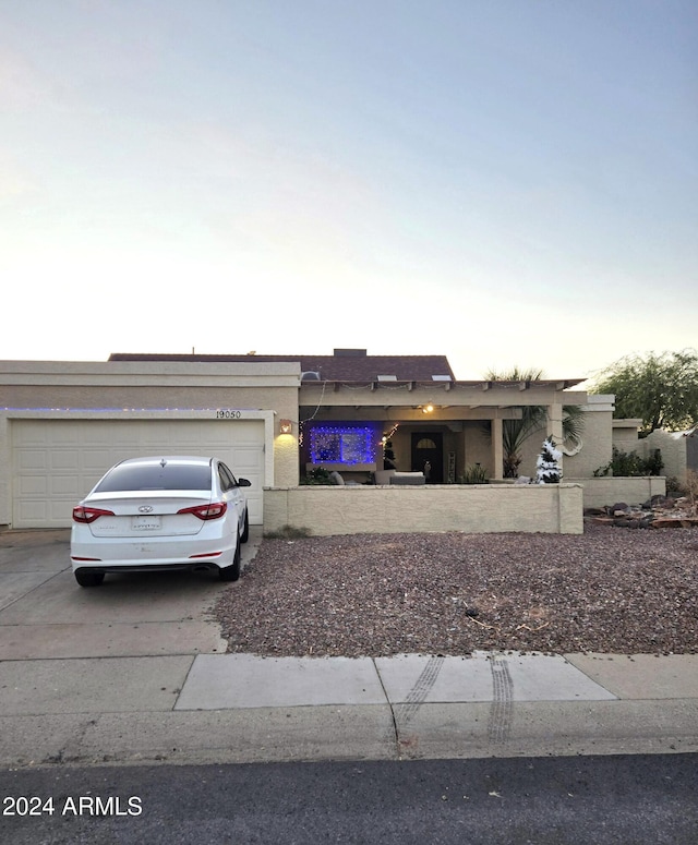 single story home featuring a garage