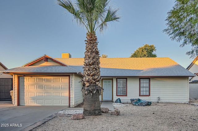 7222 W Maryland Ave, Glendale, AZ 85303 - single story home featuring a shingled roof, concrete driveway, a chimney, and an attached garage