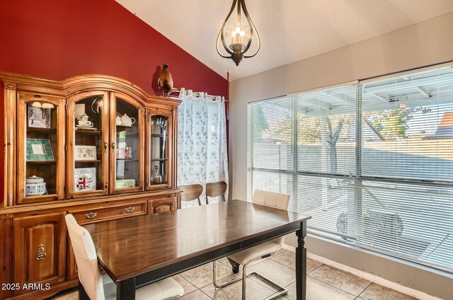 7222 W Maryland Ave, Glendale, AZ 85303 - dining space with vaulted ceiling, light tile patterned flooring, and a chandelier