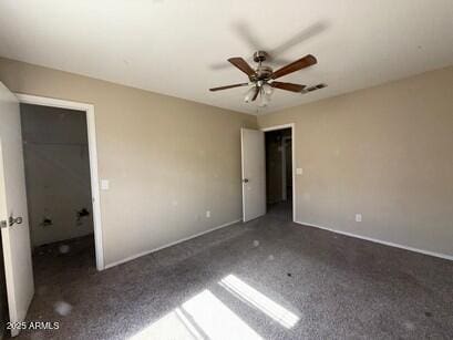 990 E Desert Rose Trl, San Tan Valley, AZ 85143 - unfurnished bedroom featuring carpet, a walk in closet, and ceiling fan