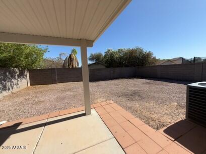 990 E Desert Rose Trl, San Tan Valley, AZ 85143 - fenced backyard with a patio area