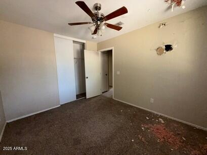 990 E Desert Rose Trl, San Tan Valley, AZ 85143 - unfurnished bedroom with a closet and a ceiling fan