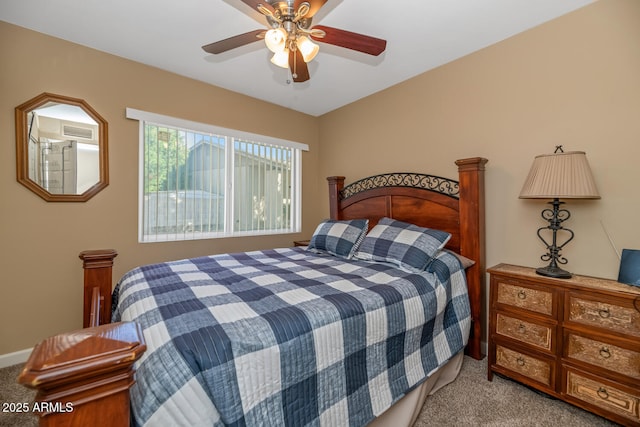carpeted bedroom with visible vents and ceiling fan