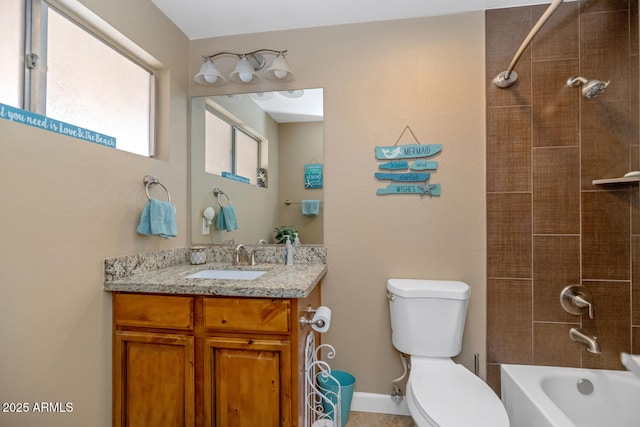 full bath featuring vanity, toilet, and washtub / shower combination