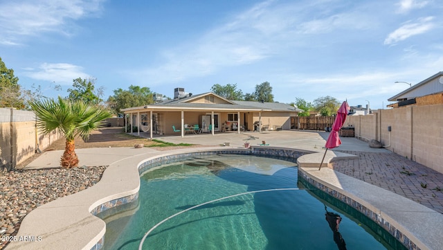 view of pool featuring a fenced in pool, a fenced backyard, and a patio area