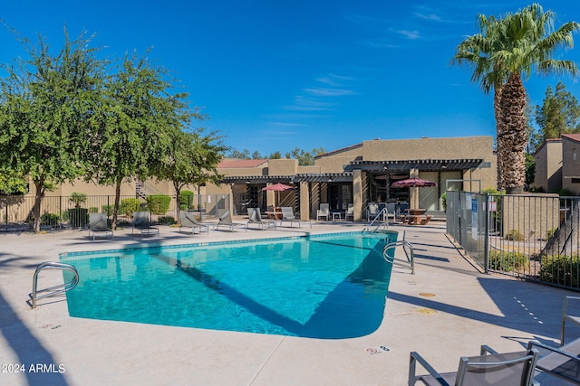 view of pool with a patio area and a pergola