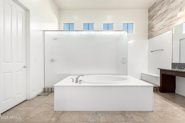 bathroom with tile patterned floors, vanity, and separate shower and tub