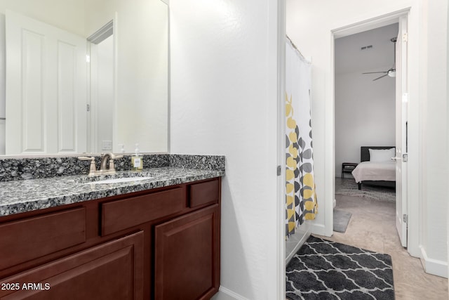 bathroom with ceiling fan, tile patterned flooring, shower / bath combo, and vanity