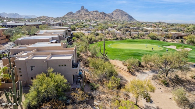 birds eye view of property with a mountain view and golf course view