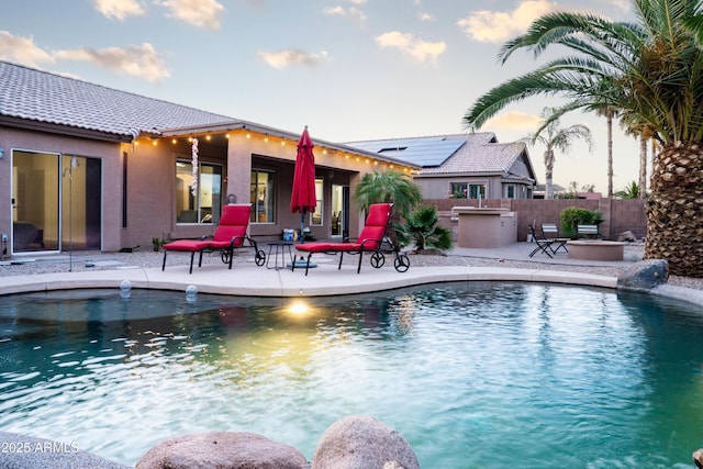 view of pool with fence, a fenced in pool, and a patio area