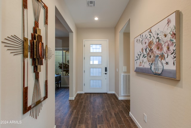 doorway to outside with dark wood-type flooring