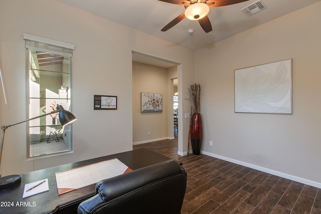 office with dark hardwood / wood-style floors and ceiling fan