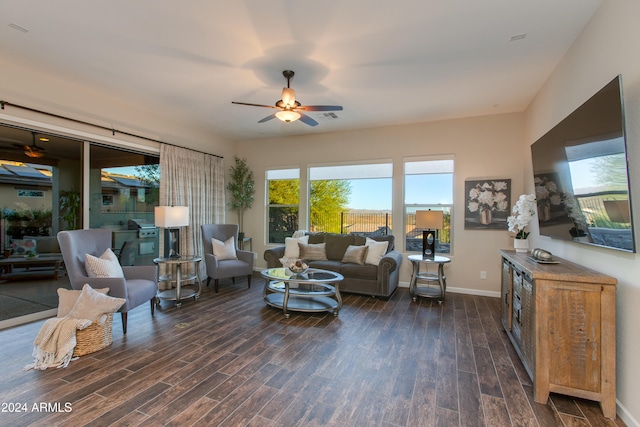 living room with dark hardwood / wood-style floors and ceiling fan