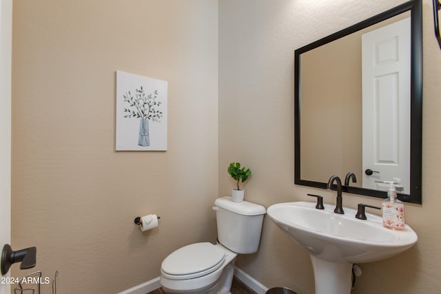 bathroom with toilet and sink