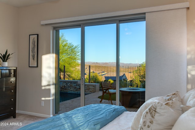 bedroom featuring a mountain view and carpet floors