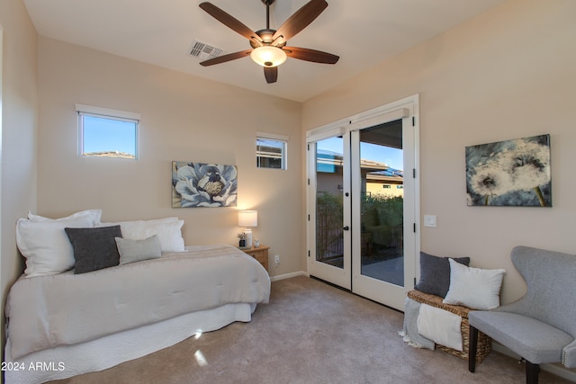 carpeted bedroom featuring french doors, access to exterior, and ceiling fan