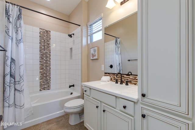 full bathroom featuring tile patterned floors, shower / bath combo, toilet, vanity, and tasteful backsplash