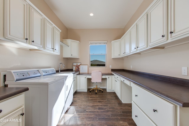 laundry area with washing machine and dryer, cabinets, sink, and dark hardwood / wood-style floors