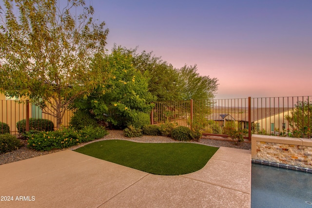 3675 Gold Ridge Rd, Wickenburg, AZ 85390 - pool at dusk with a fenced backyard, a fenced in pool, and a patio
