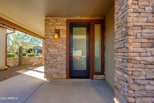 doorway to property with a patio