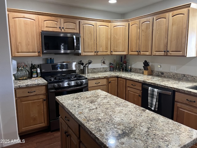 kitchen with light stone counters, a kitchen island, recessed lighting, stainless steel appliances, and dark wood-style flooring