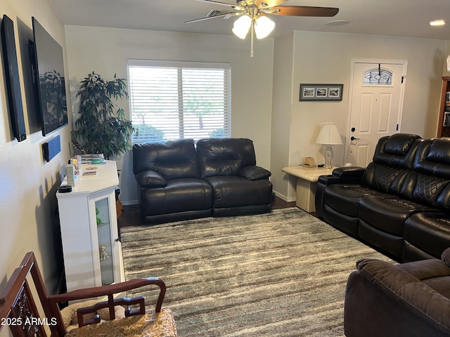 living room featuring a ceiling fan