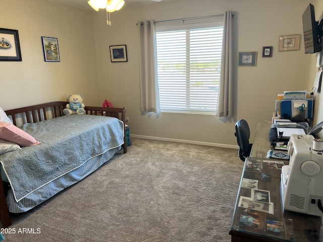 bedroom with carpet and baseboards