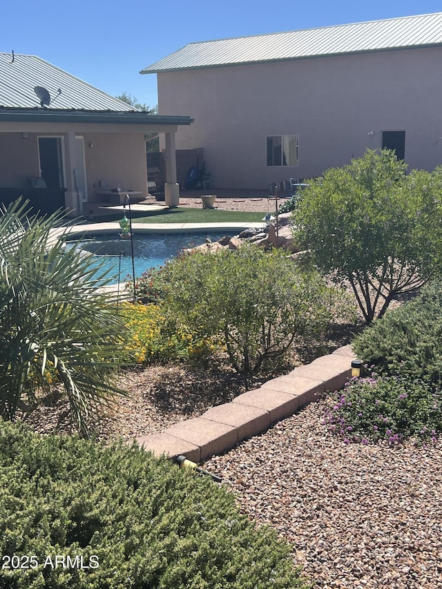 outdoor pool featuring a patio area