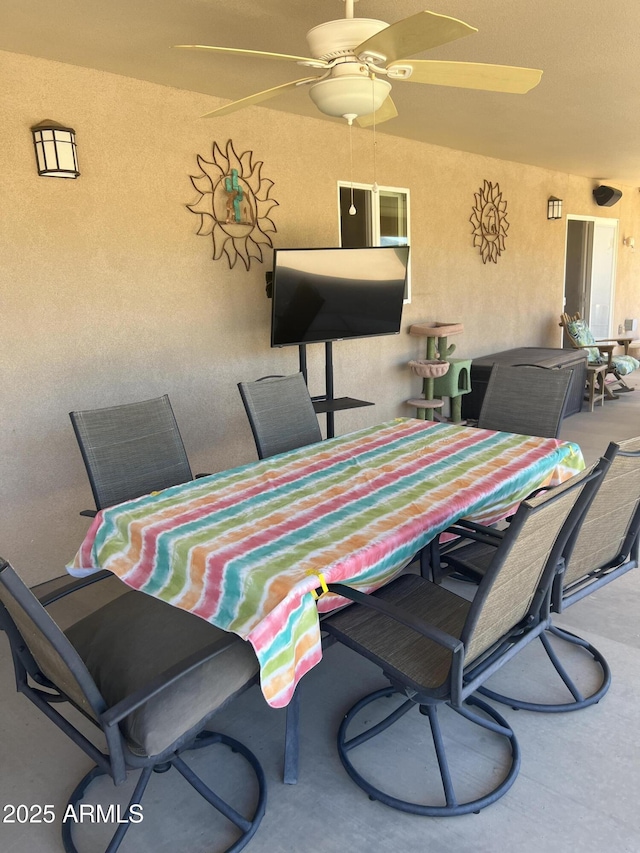 dining room featuring ceiling fan