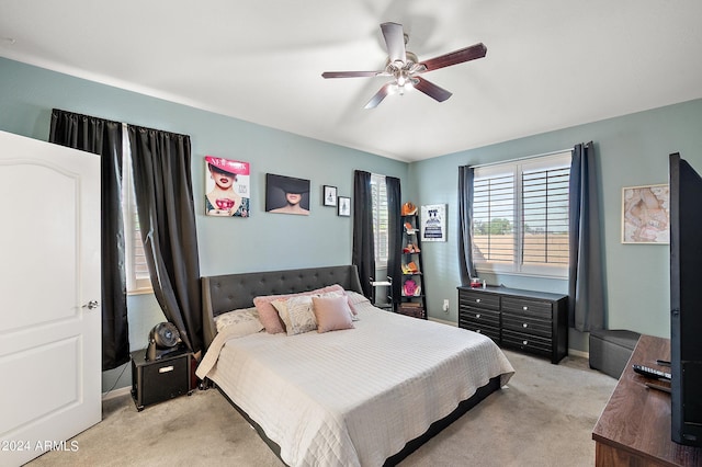bedroom featuring ceiling fan and light colored carpet